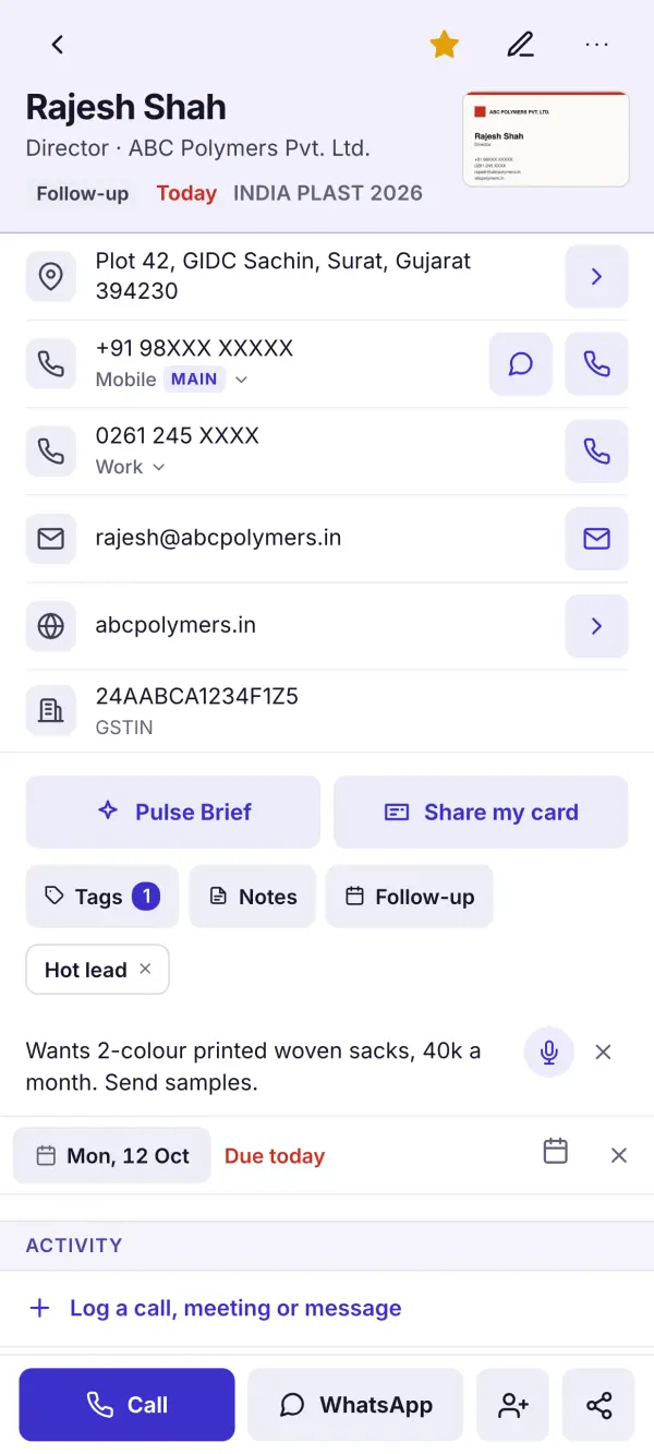 A contact read from a card, with Call and WhatsApp